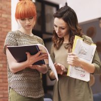 Two women working at the office